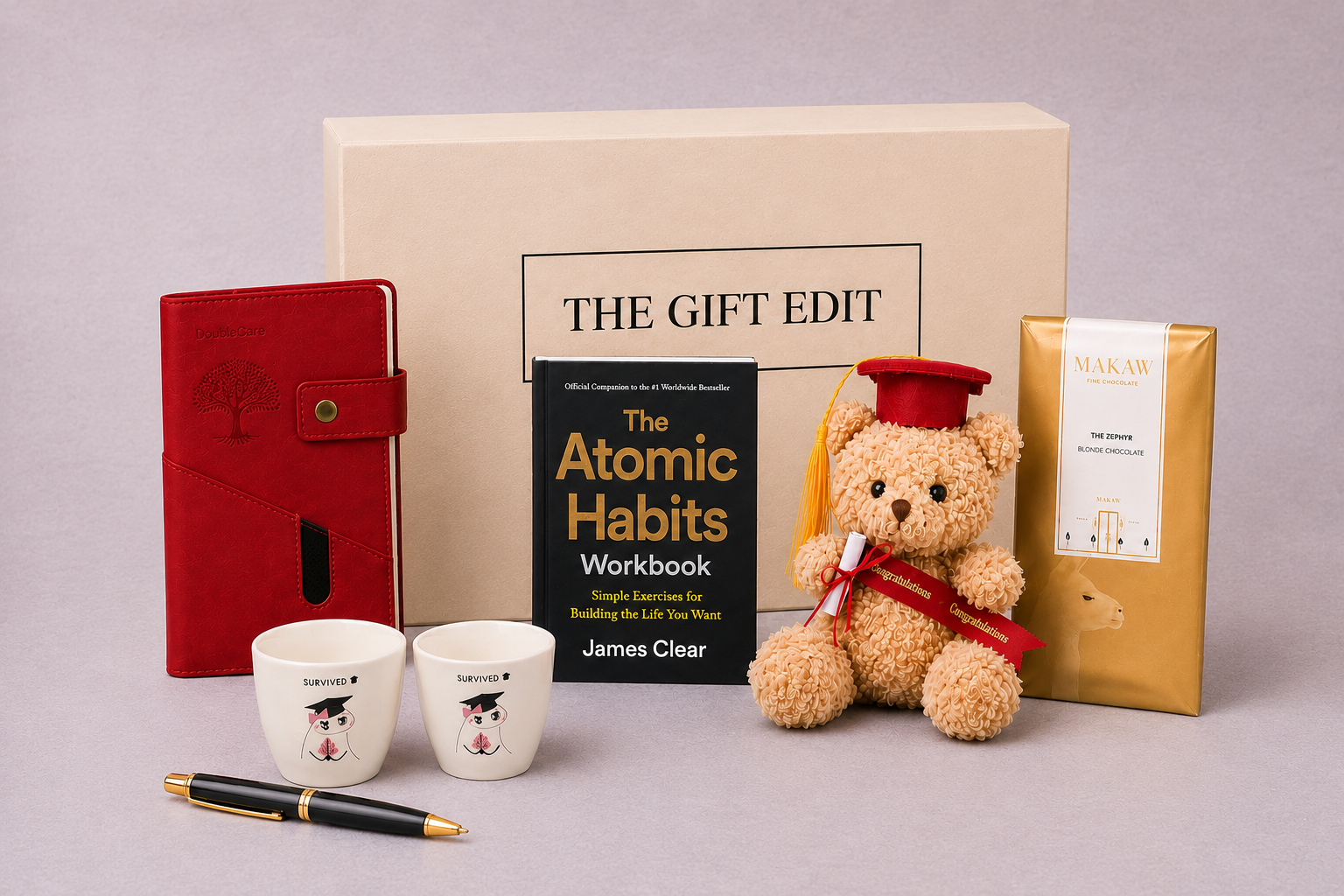 Graduation gift items for a graduation gift box in Dubai with a teddy bear, book, graduation cups and a notebook pen